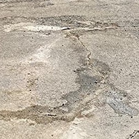 Cracked concrete pavement